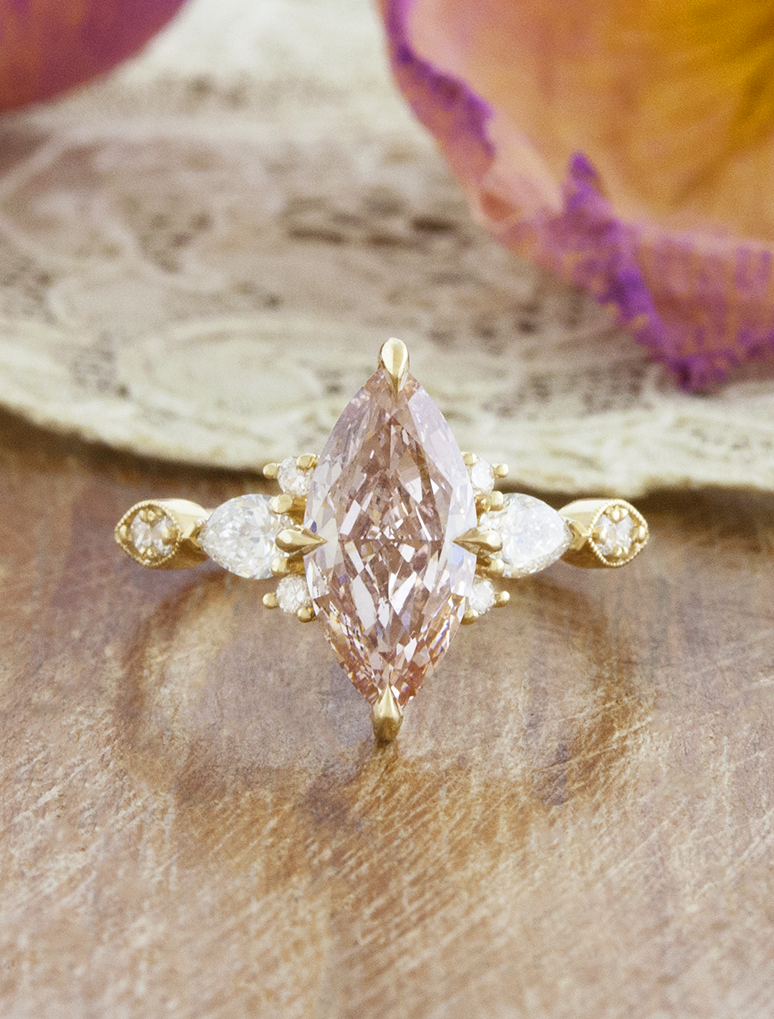 caption:Shown with 2ct fancy pink marquise in 14k yellow gold