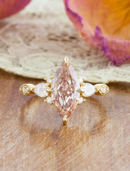 caption:Shown with 2ct fancy pink marquise in 14k yellow gold