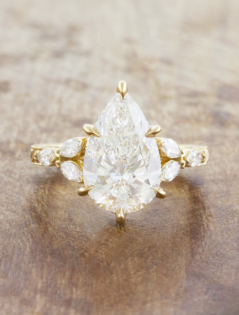caption:Shown with 3ct pear in 18k yellow gold
