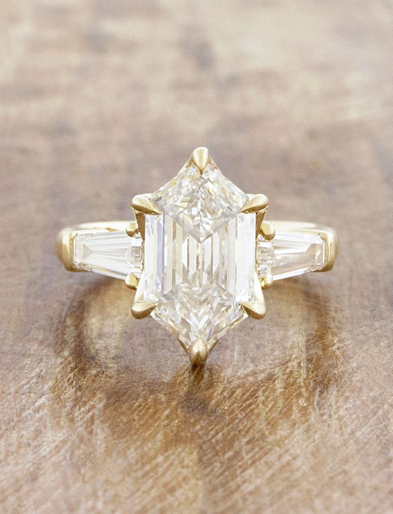 caption:Shown with 3ct elongated hexagon in 14k yellow gold 