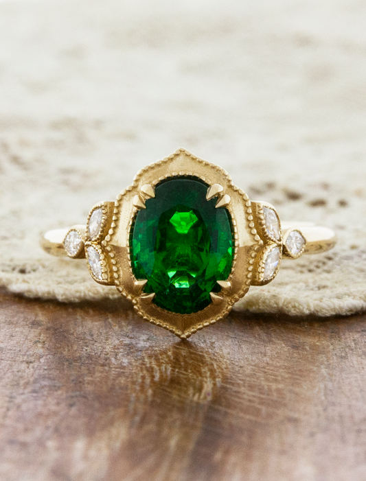 caption:Shown with 1.3ct oval emerald in 14k yellow gold