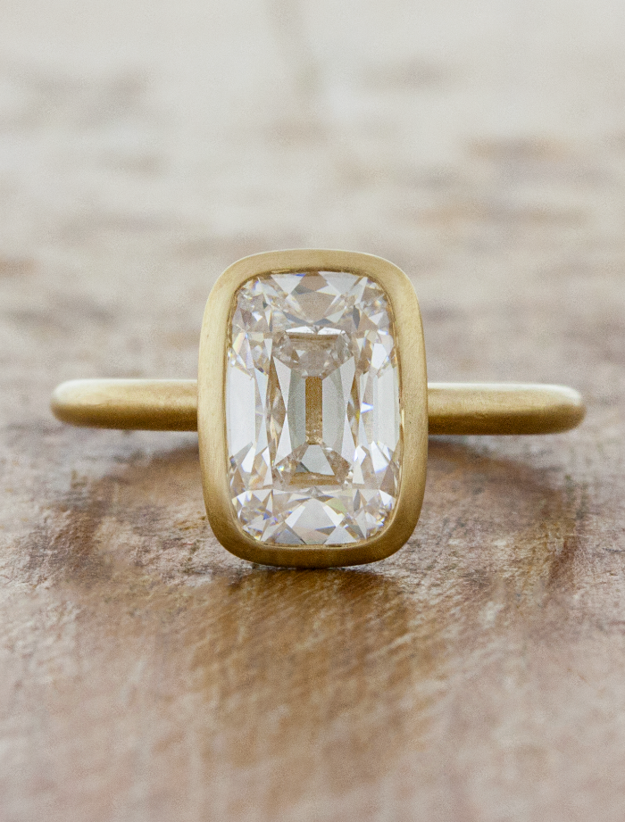caption: Shown with 2.5ct Old Mine Cut diamond in 14k yellow gold