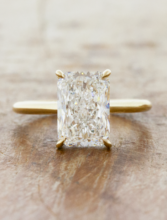 caption:Shown with 3ct radiant cut in 14k yellow gold 
