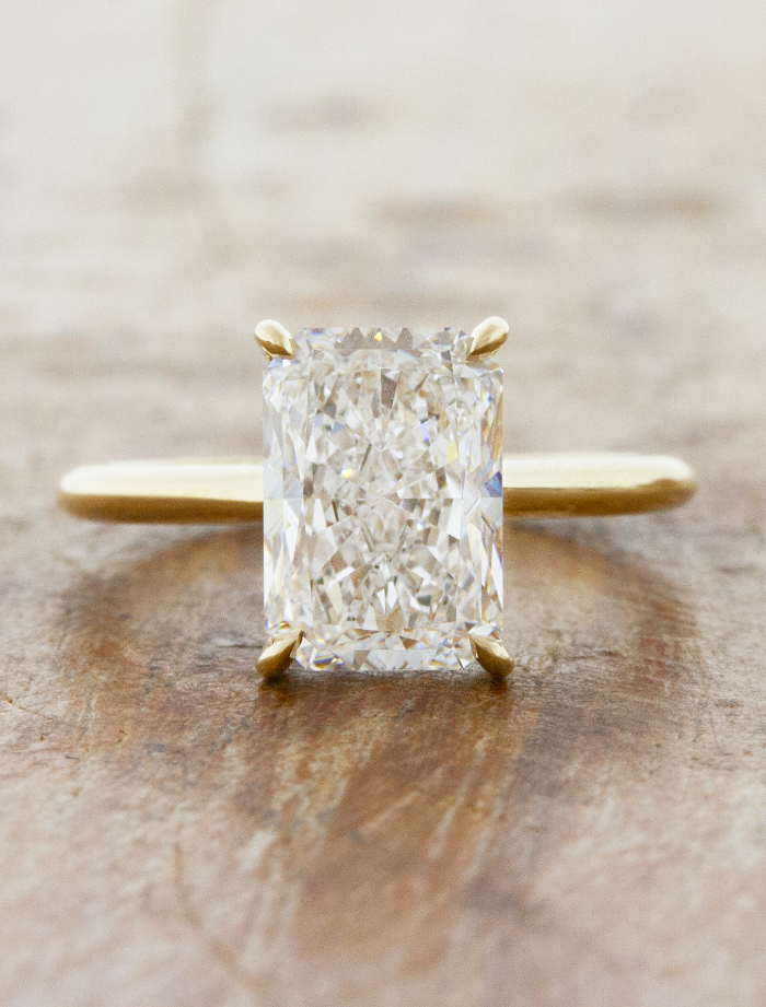 caption:Shown with 3ct radiant cut in 14k yellow gold 