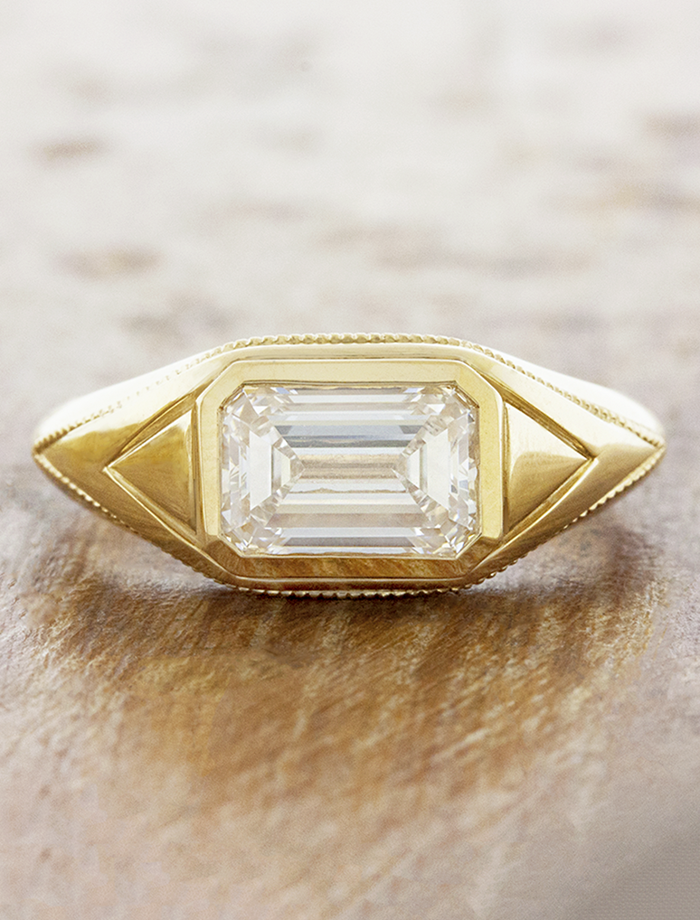 caption:Shown with 2ct emerald cut in 14k yellow gold 