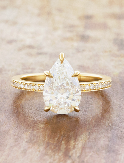 caption:Shown with 2ct pear in 18k yellow gold