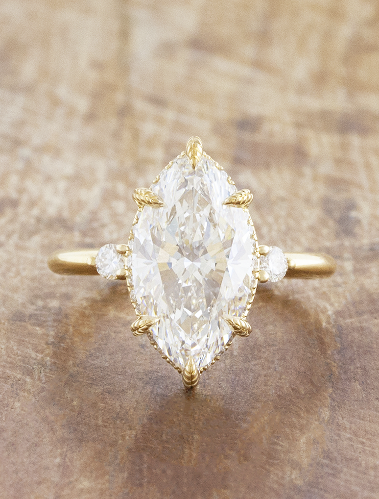 caption:Shown with 3ct marquise in 18k yellow gold 
