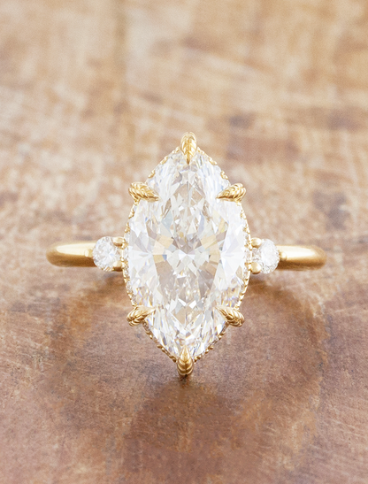 caption:Shown with 3ct marquise in 18k yellow gold 