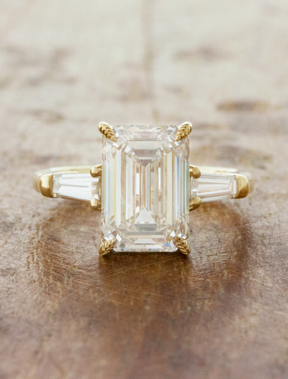 caption:Shown with 3ct emerald cut diamond in 14k yellow gold