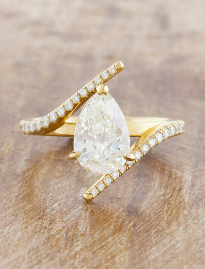 caption:Shown with 2ct pear in 18k yellow gold