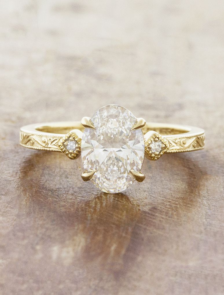 caption:Shown with 1.5ct oval in 14k yellow gold