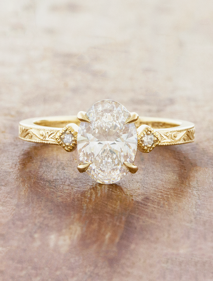 caption:Shown with 1.5ct oval in 14k yellow gold