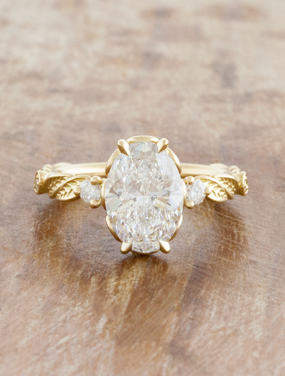 caption:Shown with 1.5ct oval in 14k yellow gold