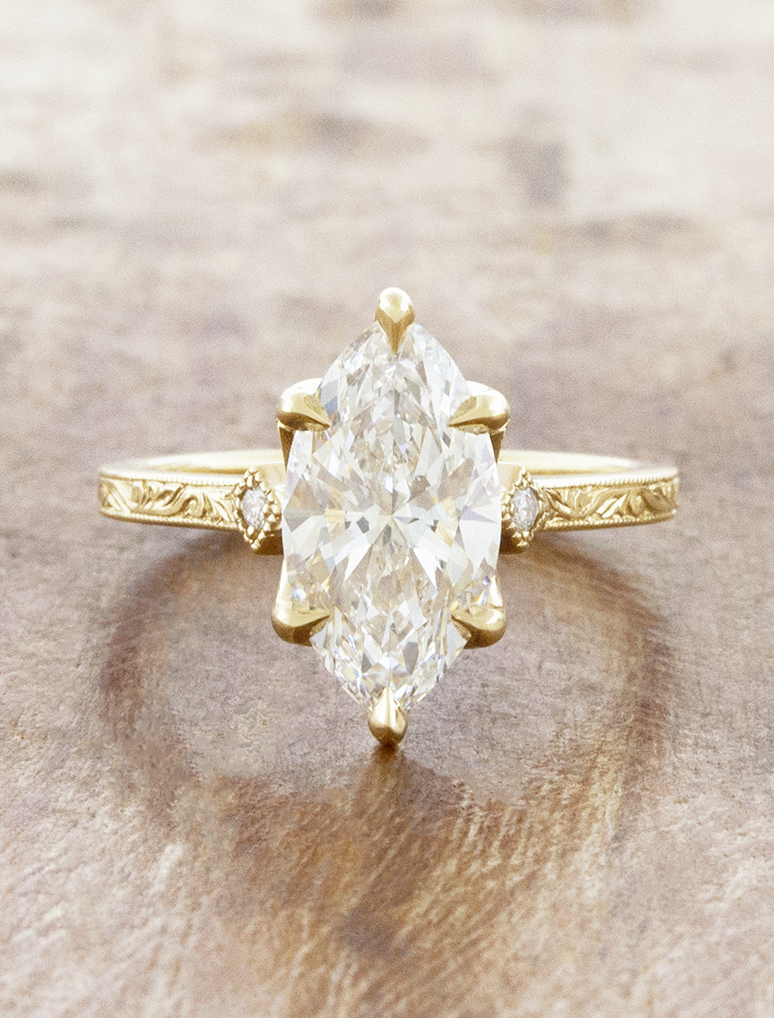 caption:Shown with 2.5ct marquise in 14k yellow gold