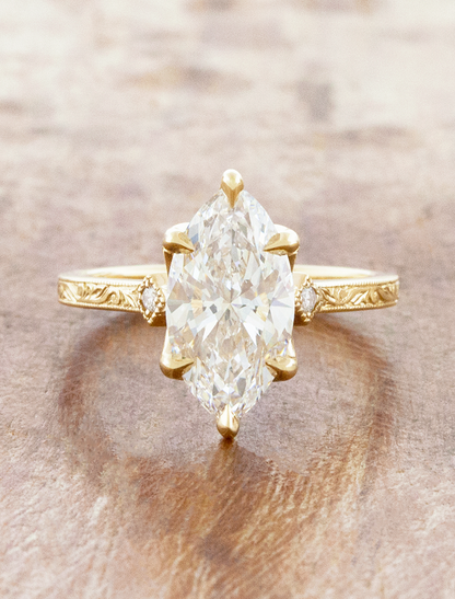 caption:Shown with 2.5ct marquise in 14k yellow gold