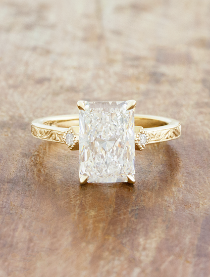 caption:Shown with 3ct radiant cut in 14k yellow gold 