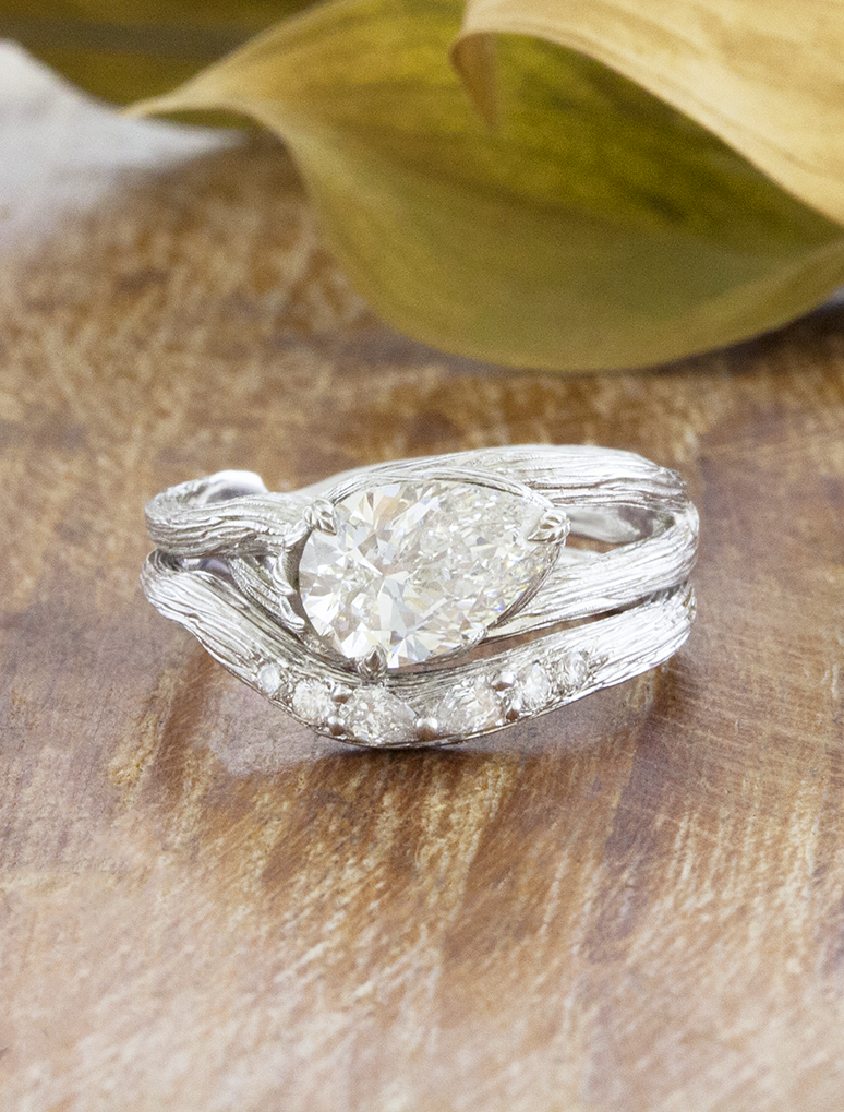 caption:Shown with 1.5ct pear in white white gold, stacked with Isle
