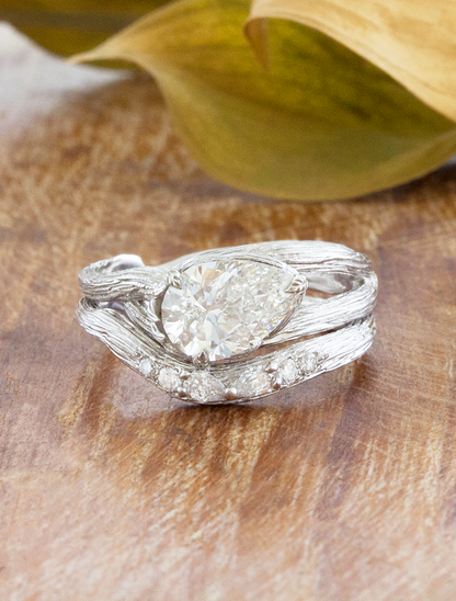 caption:Shown with 1.5ct pear in white white gold, stacked with Isle