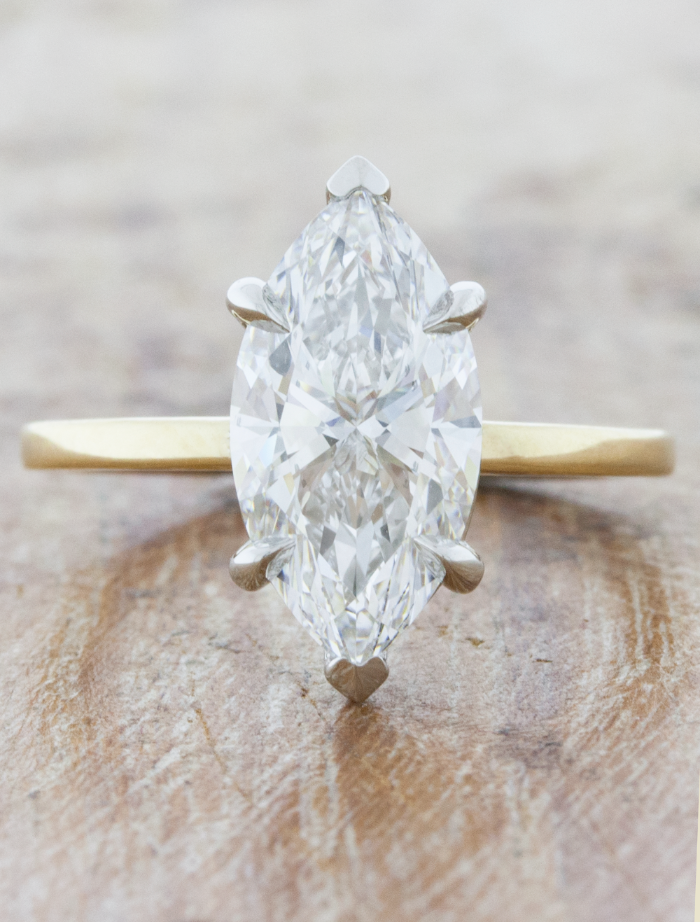 caption:Shown with 2.5ct marquise diamond in mixed platinum & 14k yellow gold