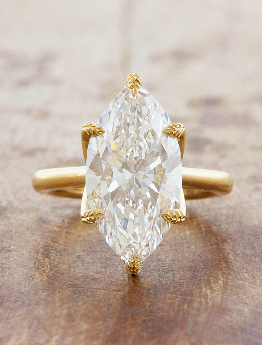 caption:Shown with 4ct marquise diamond in 18k yellow gold
