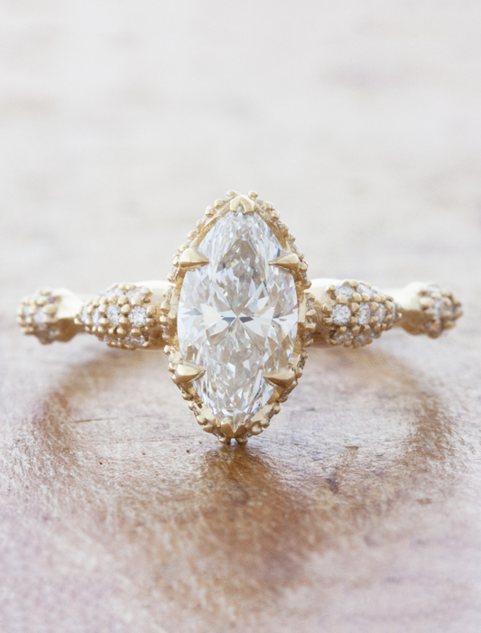 caption:Shown with 1ct marquise diamond in 14k yellow gold