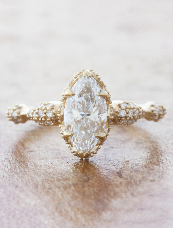 caption:Shown with 1ct marquise diamond in 14k yellow gold