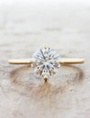 Caption:Shown with 1.7ct round diamond