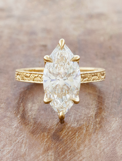 caption:Shown with 3ct marquise in 18k yellow gold 