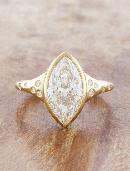 caption:Shown with 2ct marquise in 14k yellow gold 