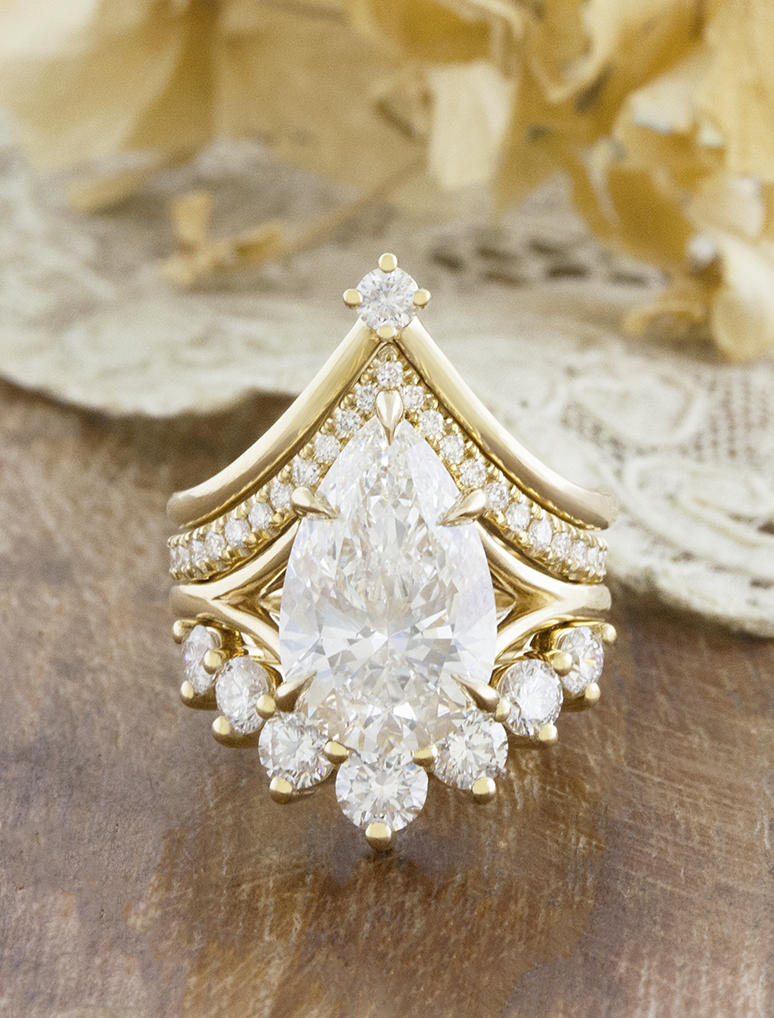 caption:Shown with Mylex 4ct pear, Alexia & Antoinette Large wedding bands
