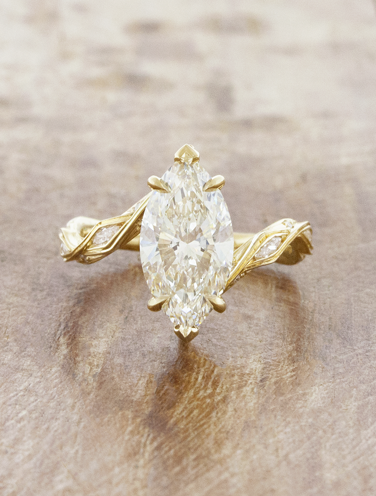 caption:Shown with 2.5ct marquise in 14k yellow gold