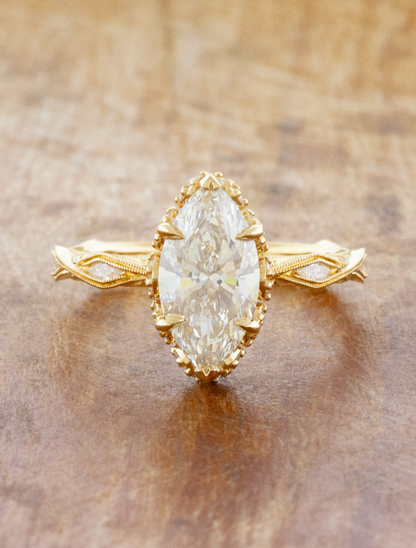 caption:Shown with 2.09ct marquise in 14k yellow gold 