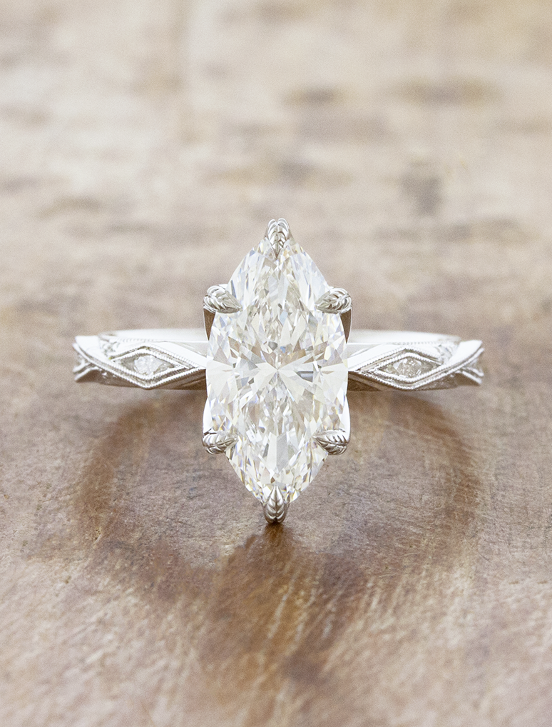 caption:Shown with 2.5ct marquise in platinum