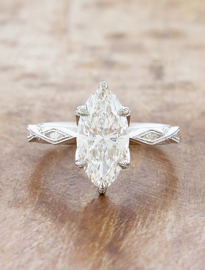 caption:Shown with 2.5ct marquise in platinum
