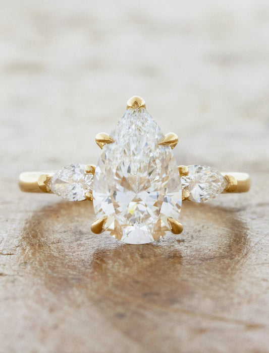 caption:Shown wtih 2ct pear diamond in 14k yellow gold