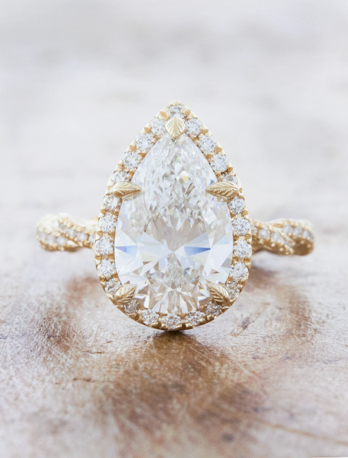 caption:Shown with 3ct pear diamond in 14k yellow gold