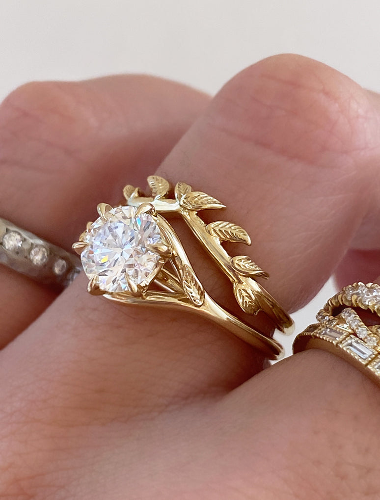 caption:Shown with 1.2ct round in 14k yellow gold, stacked with Addy wedding band