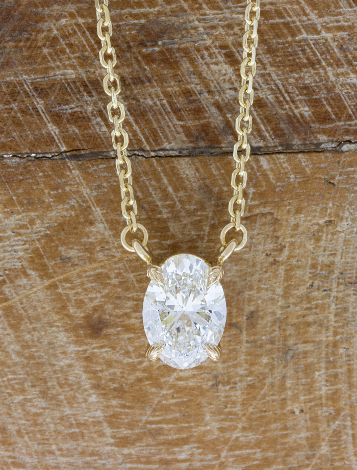 caption:Shown with 1.50ct oval diamond in 14k yellow gold
