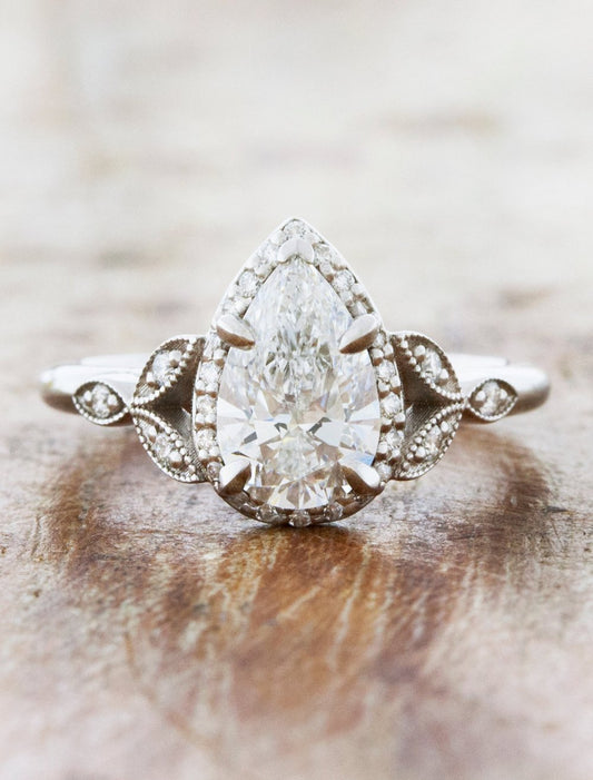 caption:Shown with 1.04ct pear diamond in platinum