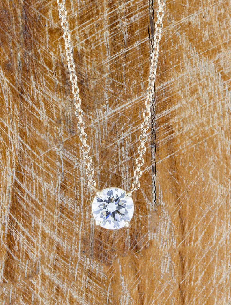 caption:Shown with 1.25ct round diamond in 14k rose gold