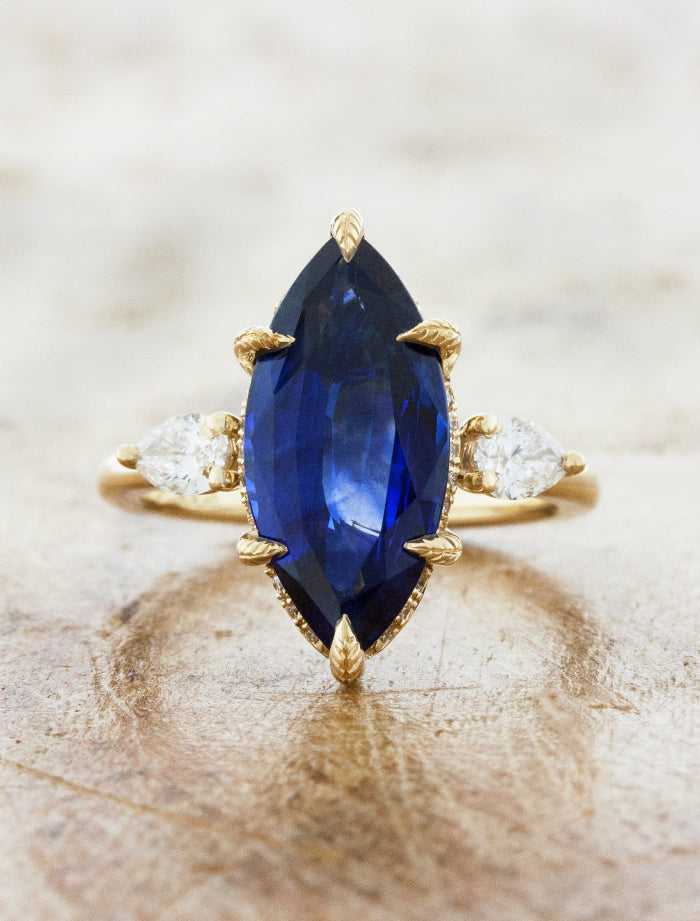 caption:Shown with 4ct marquise sapphire in 14k yellow gold