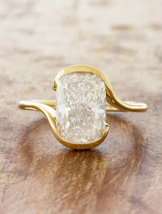caption:Shown with 3ct elongated cushion cut in 14k yellow gold 