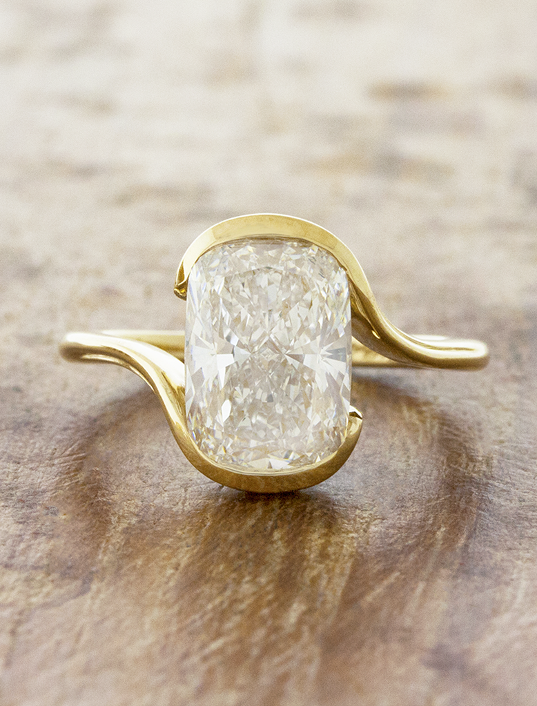caption:Shown with 3ct elongated cushion cut in 14k yellow gold 