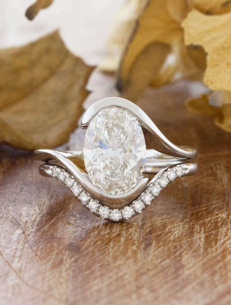 caption:2ct Oval in Platinum, shown stacked with custom curved Catherine wedding band 