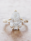 caption:Shown with 4ct pear diamond in 14k yellow gold