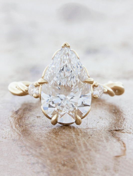 caption:Shown with 3ct pear diamond in 14k yellow gold