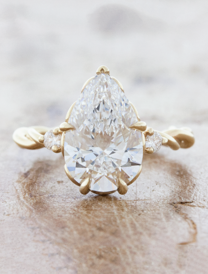 caption:Shown with 3ct pear diamond in 14k yellow gold