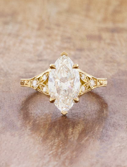caption:Shown with 2ct marquise in 18k yellow gold