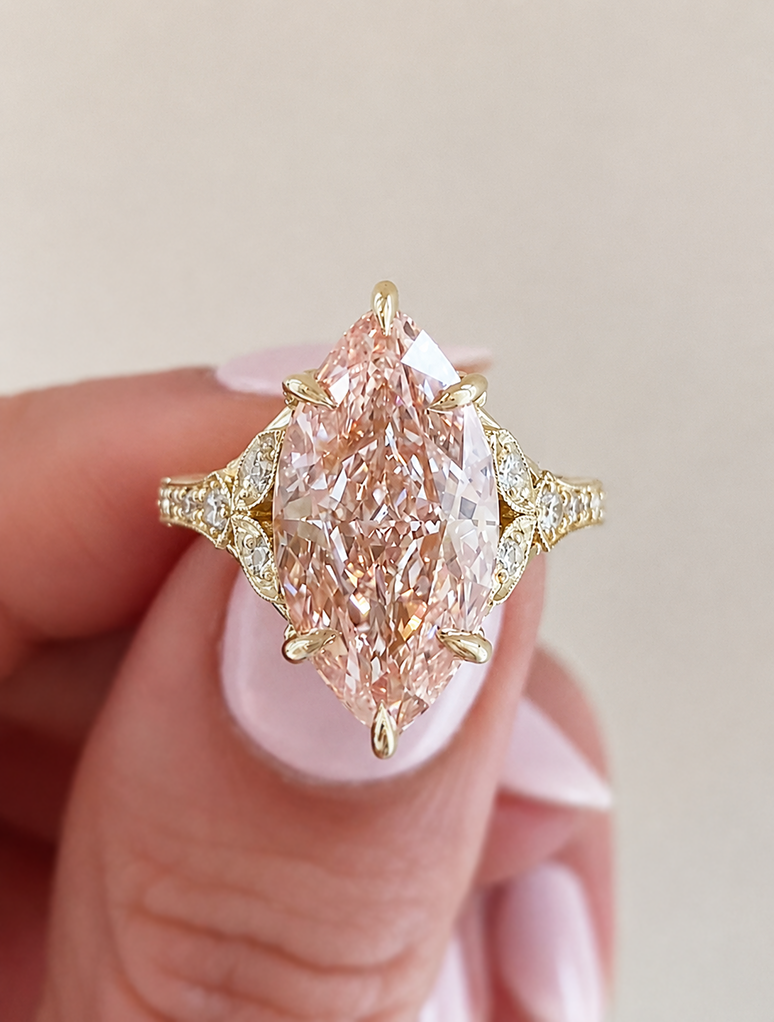 caption:Shown with 4ct fancy pink marquise in 14k yellow gold