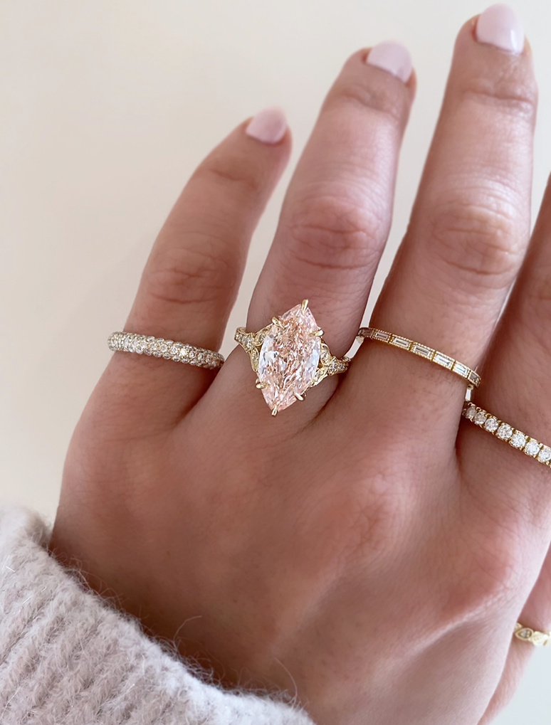 caption:Shown with 4ct fancy pink marquise in 14k yellow gold
